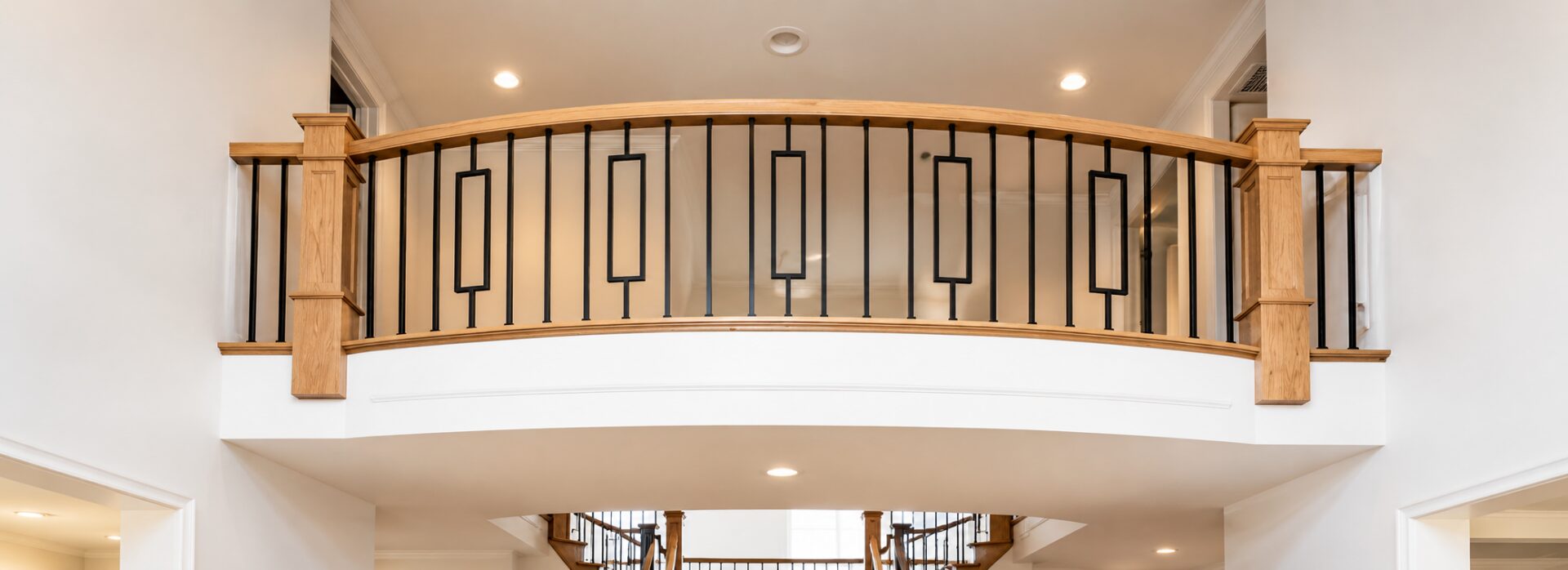 Curved balcony with wooden railing design