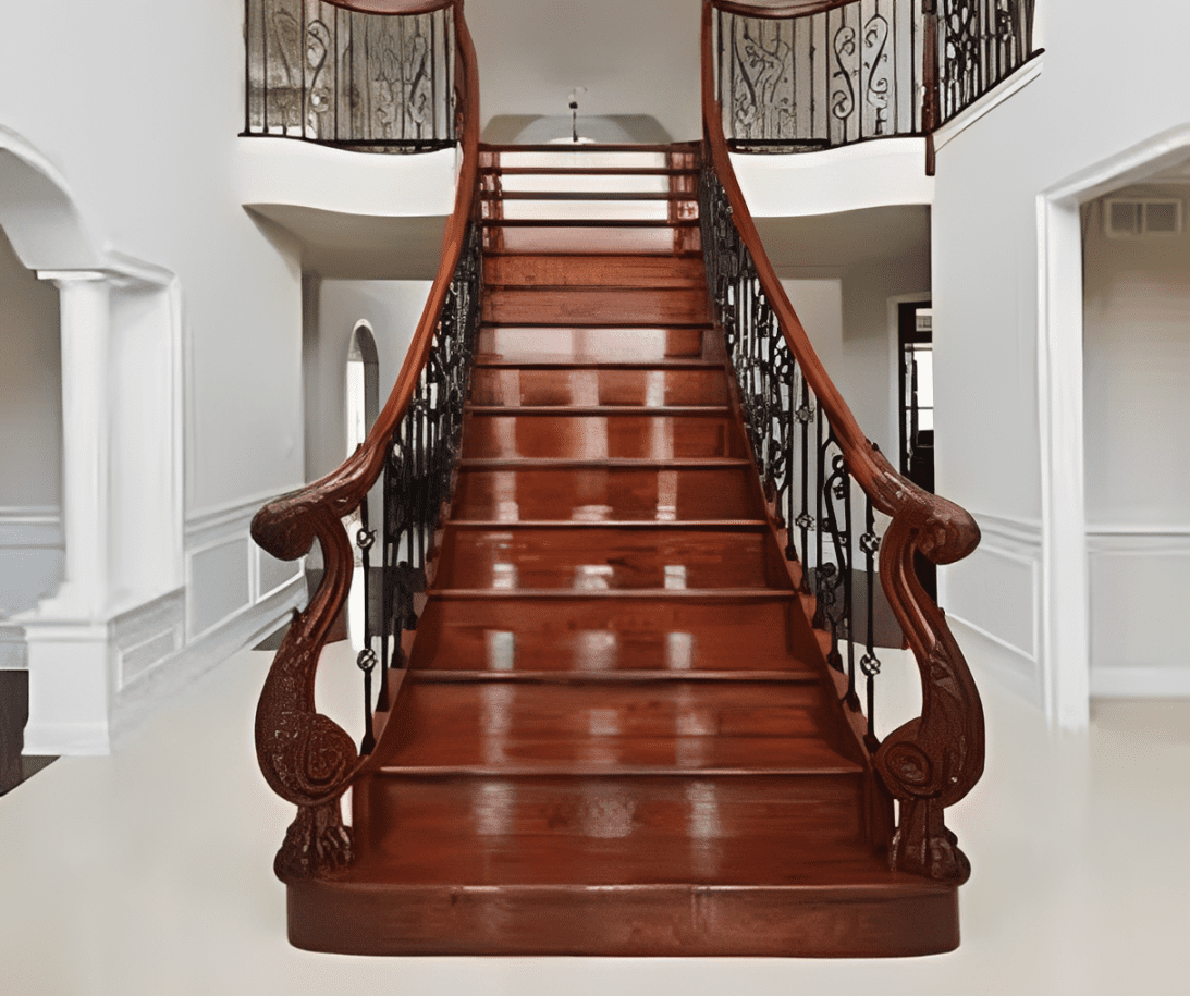 Grand wooden staircase with ornate railings