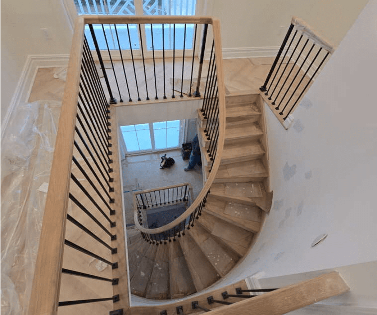 Wooden spiral staircase with metal railings