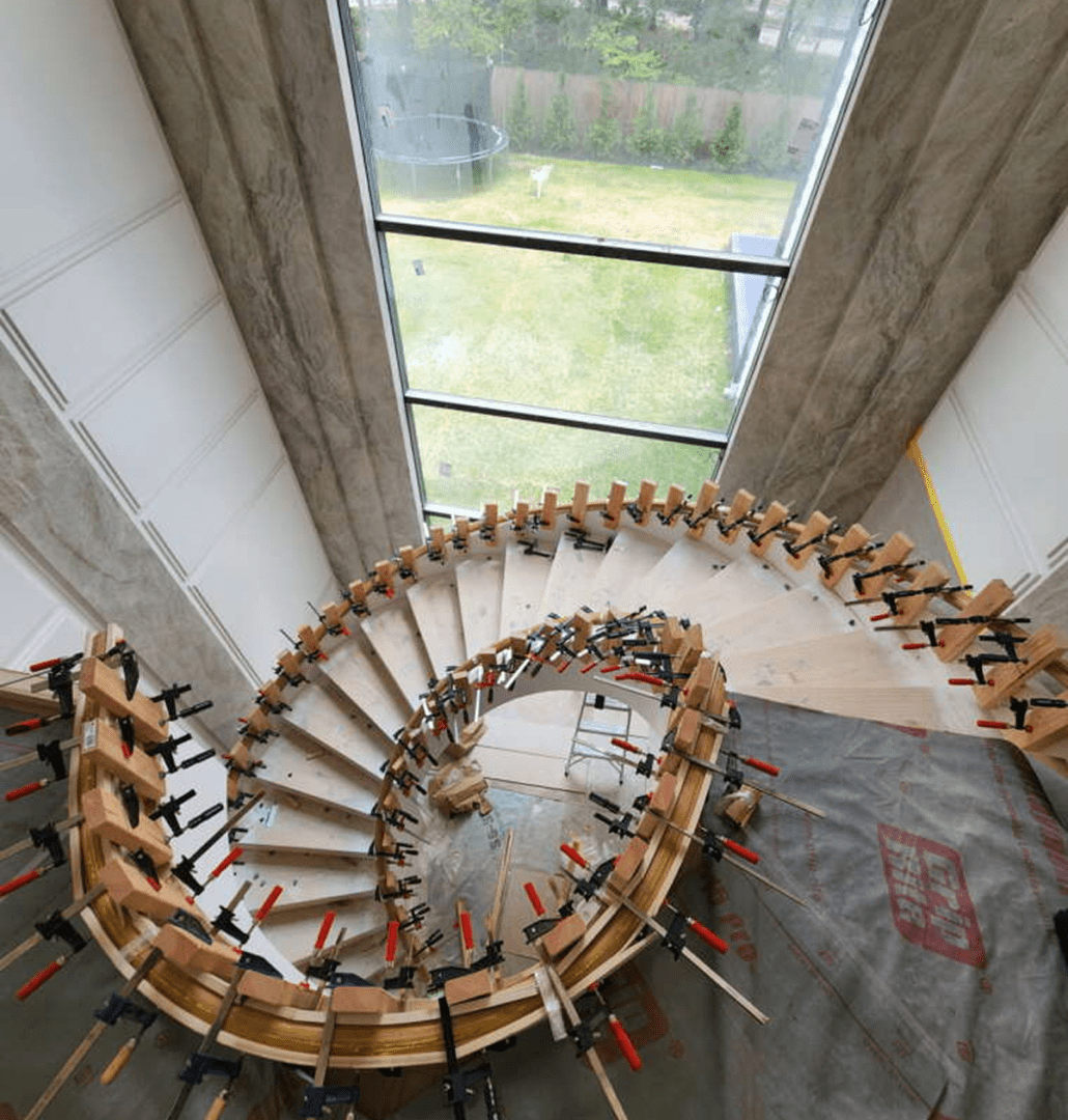 Spiral staircase under construction with clamps