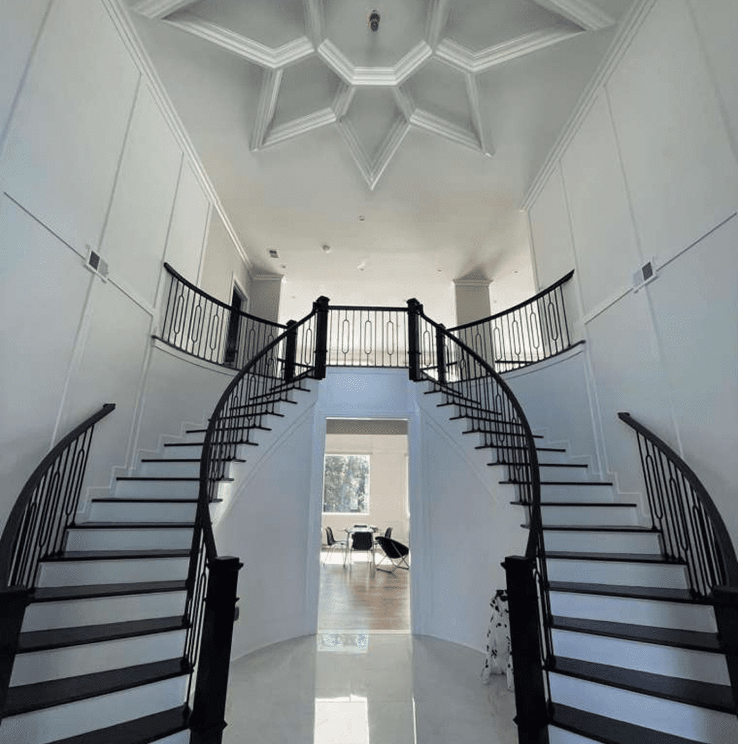 Grand double staircase with elegant railing