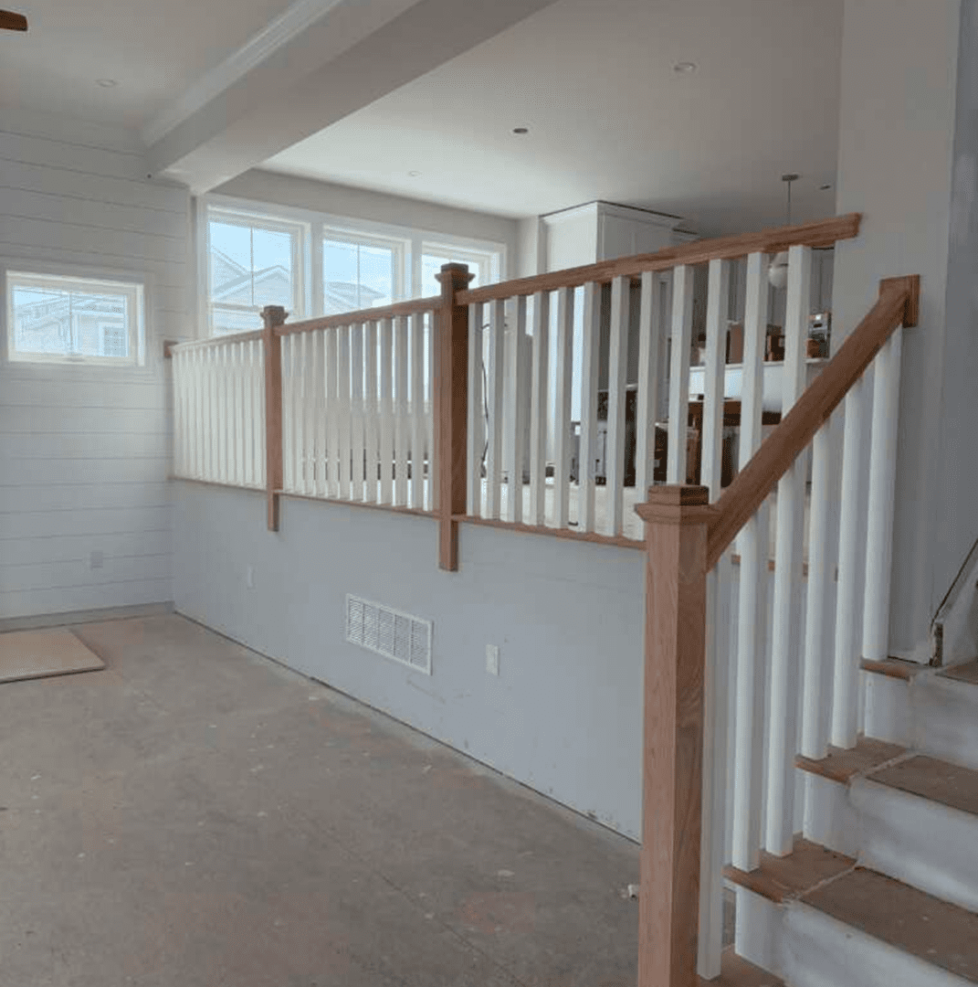 Wooden railing in unfinished room