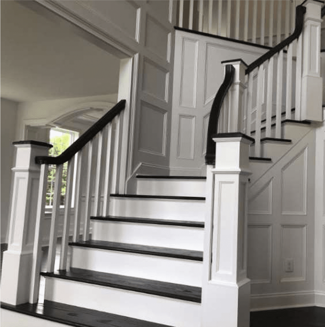 Stylish staircase with panelled walls